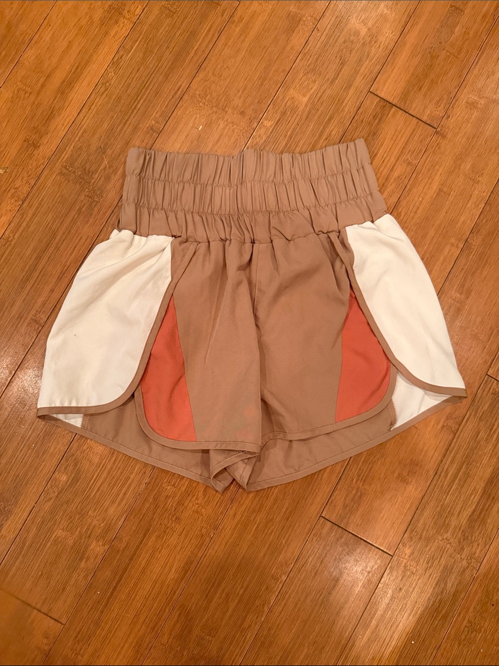 High-Waist Tan Athletic Shorts with White Panels and Rust Accents